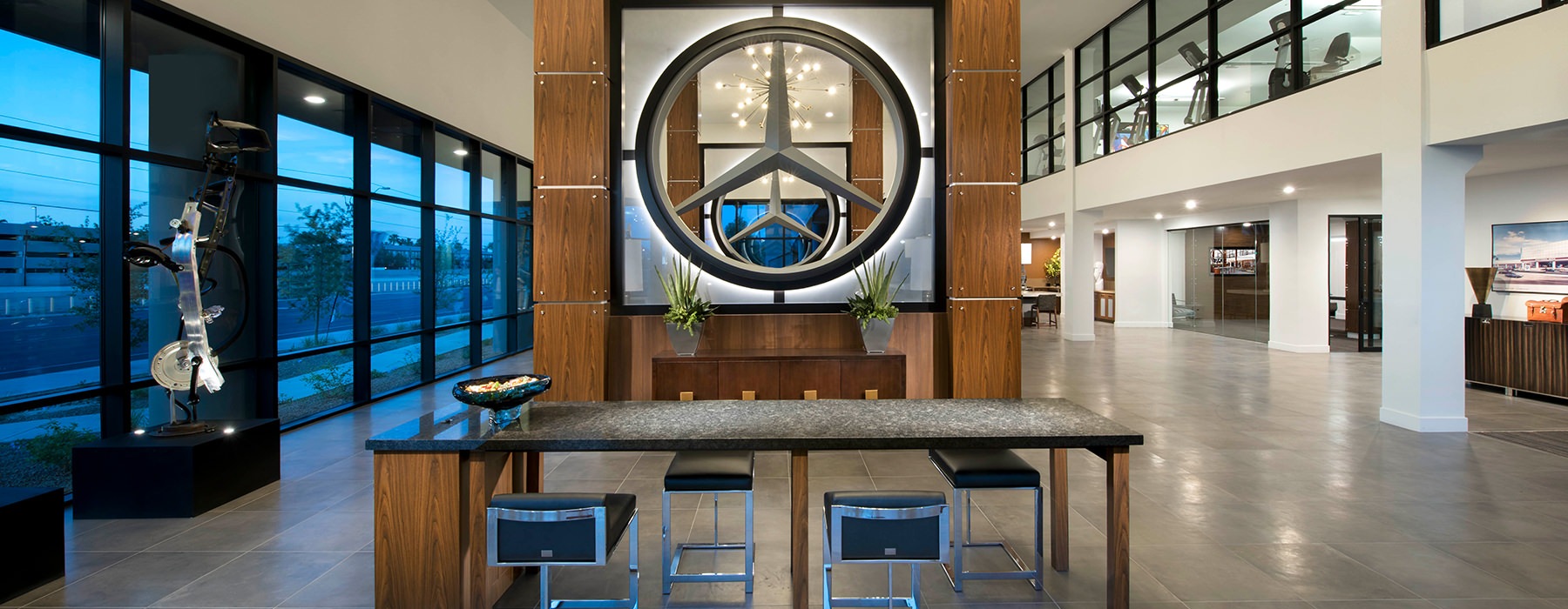 Open lobby with high ceilings and floor-to-ceiling windows